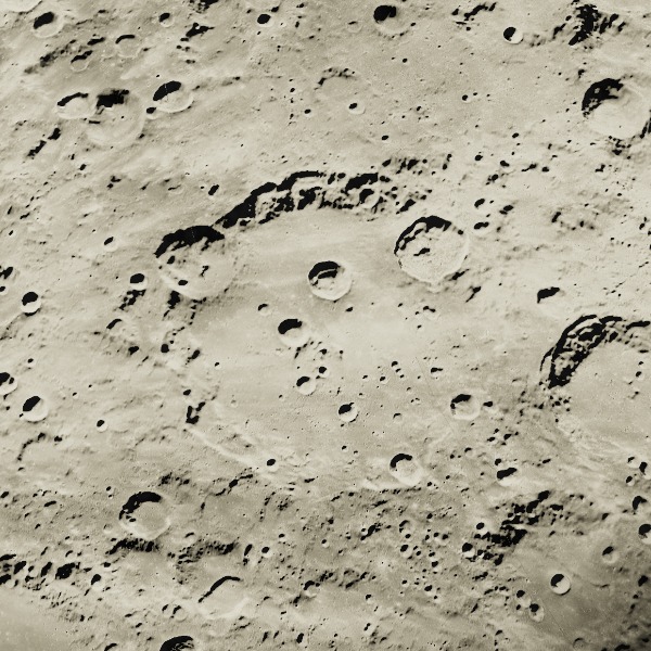 Clavius — relief close-up under low, raking sunlight near the terminator