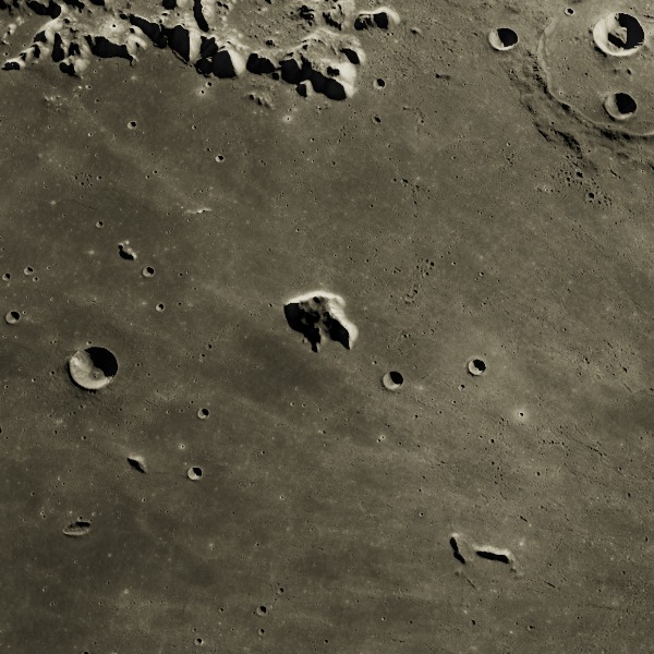 Mons Piton — relief close-up under low, raking sunlight near the terminator