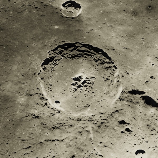 Theophilus — relief close-up under low, raking sunlight near the terminator