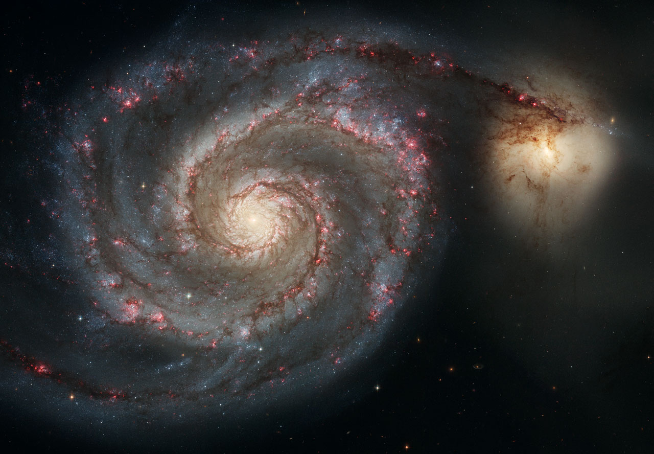 Hubble Space Telescope image of the Whirlpool Galaxy M51 showing its grand spiral arms and the companion NGC 5195