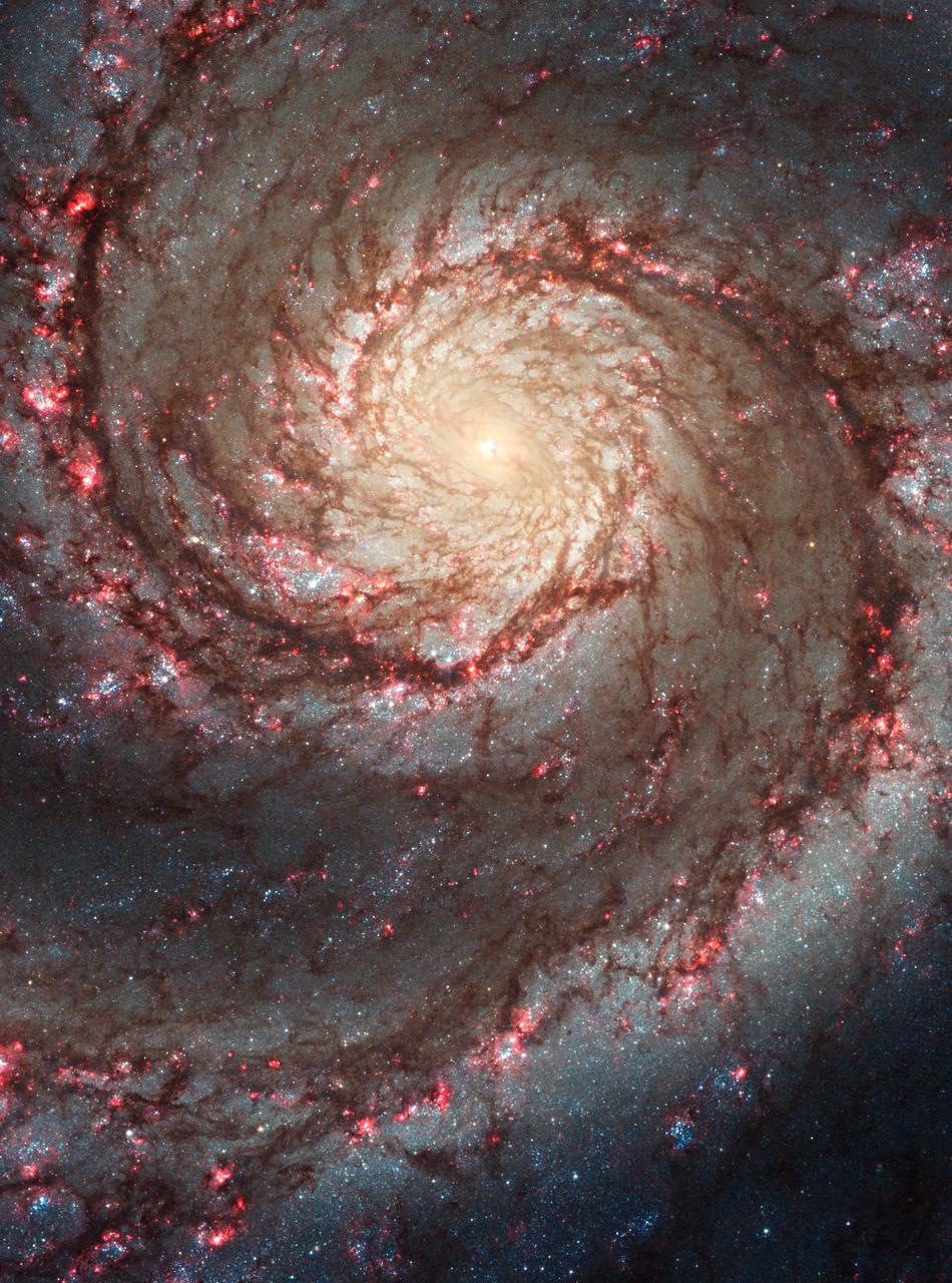 The Whirlpool Galaxy (M51) from the Hubble Space Telescope, showing sweeping spiral arms and a smaller companion galaxy